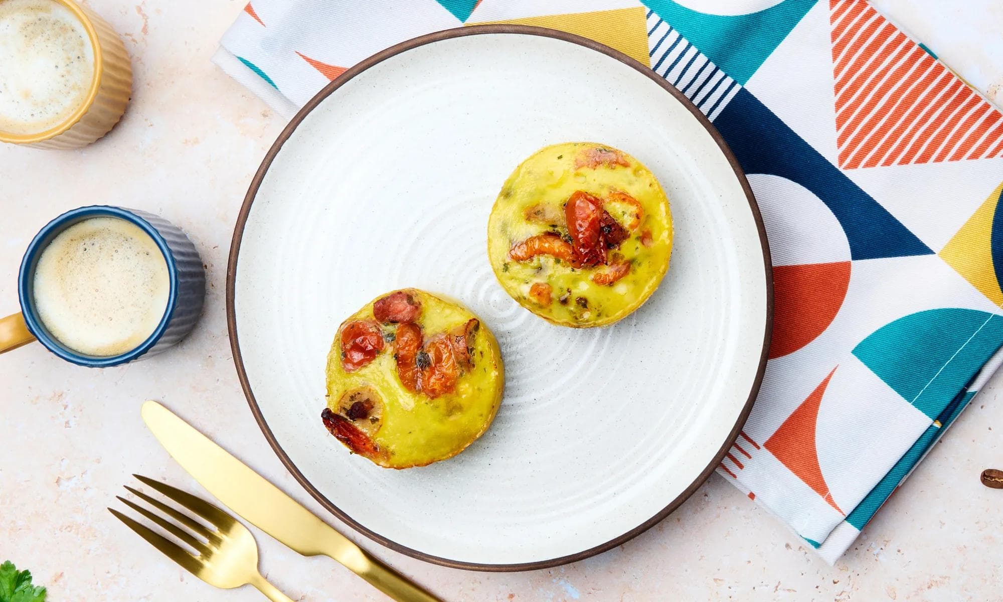 Egg muffin bites with tomato and a coffee