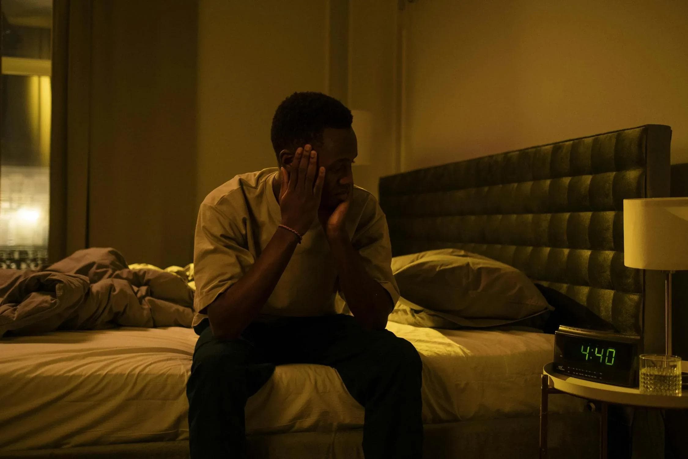Man awake at night with insomnia