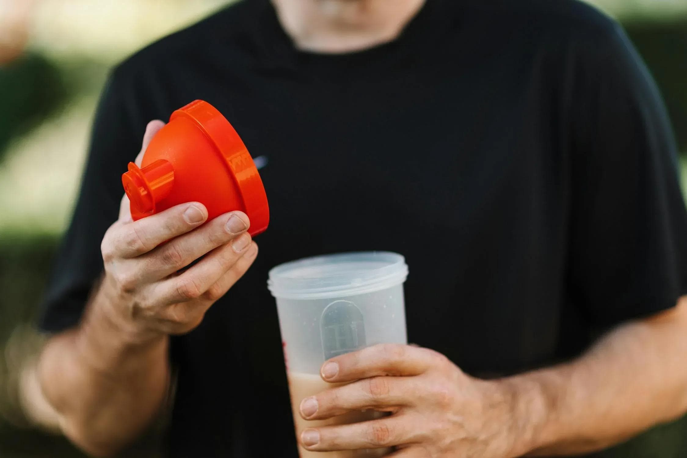 Man mixing protein shaker
