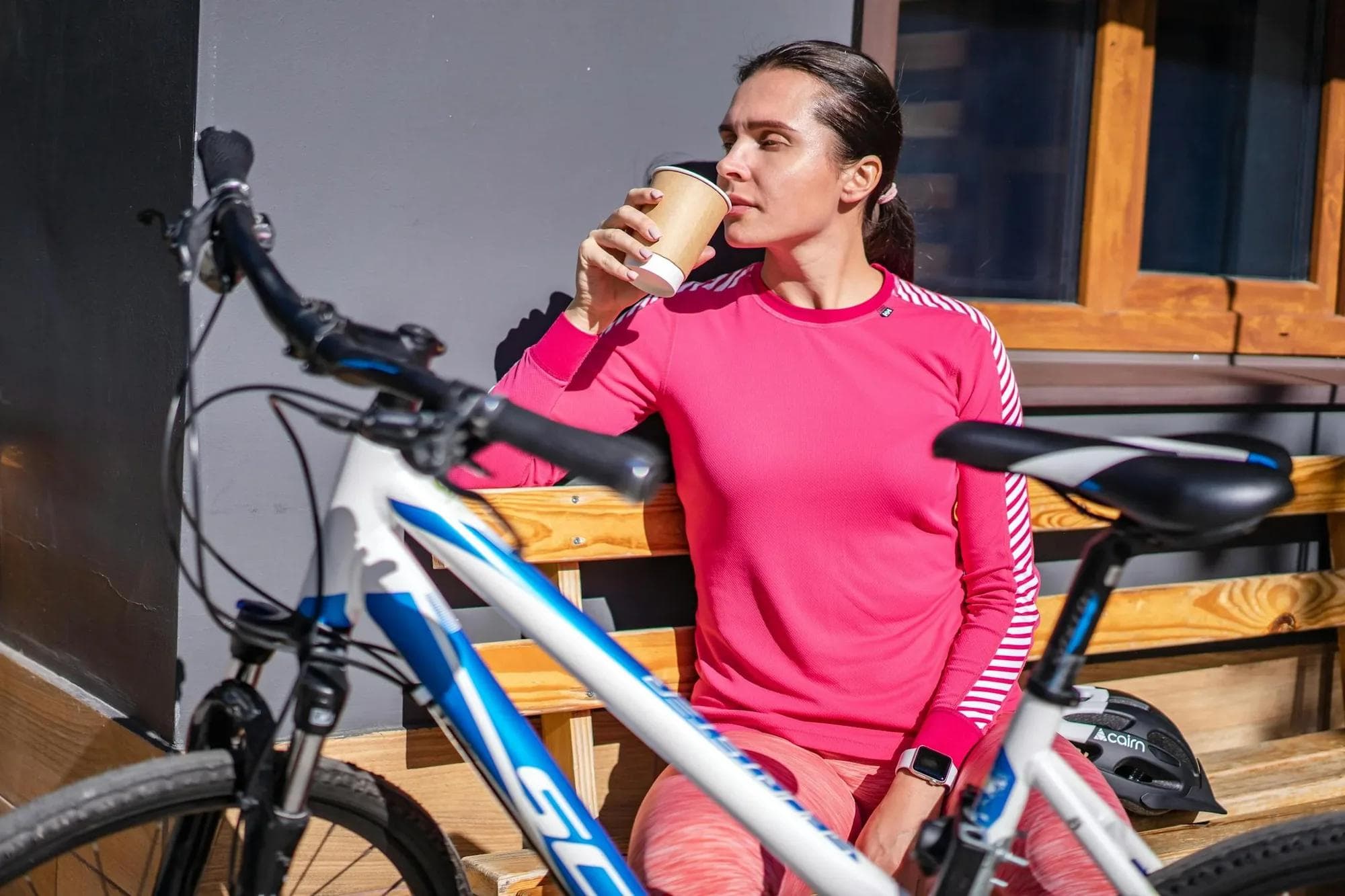 Cyclist drinking coffee during a break