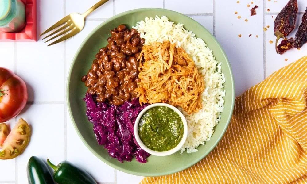 Mexican rice and beans with chicken and salsa